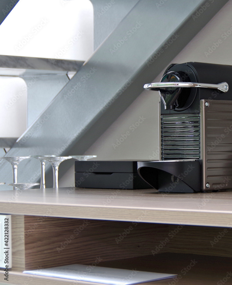 Coffee espresso maker and mini bar selection amenities inside suite stateroom cabin onboard