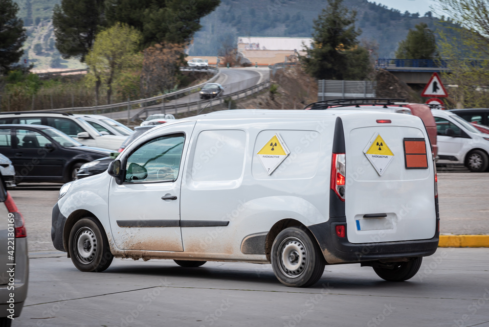Van with radioactive hazard labels, signs included in the European agreement for the transport of dangerous goods by road (ADR) Van with radioactive hazard labels, signs included in the European agreement for the transport of dangerous goods by road (ADR)