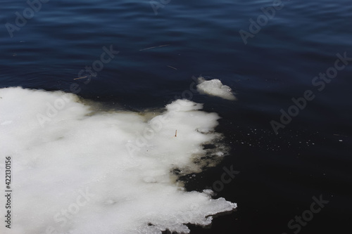 Close-up of a melting ice-floe in the river on a sunny spring day as a natural background