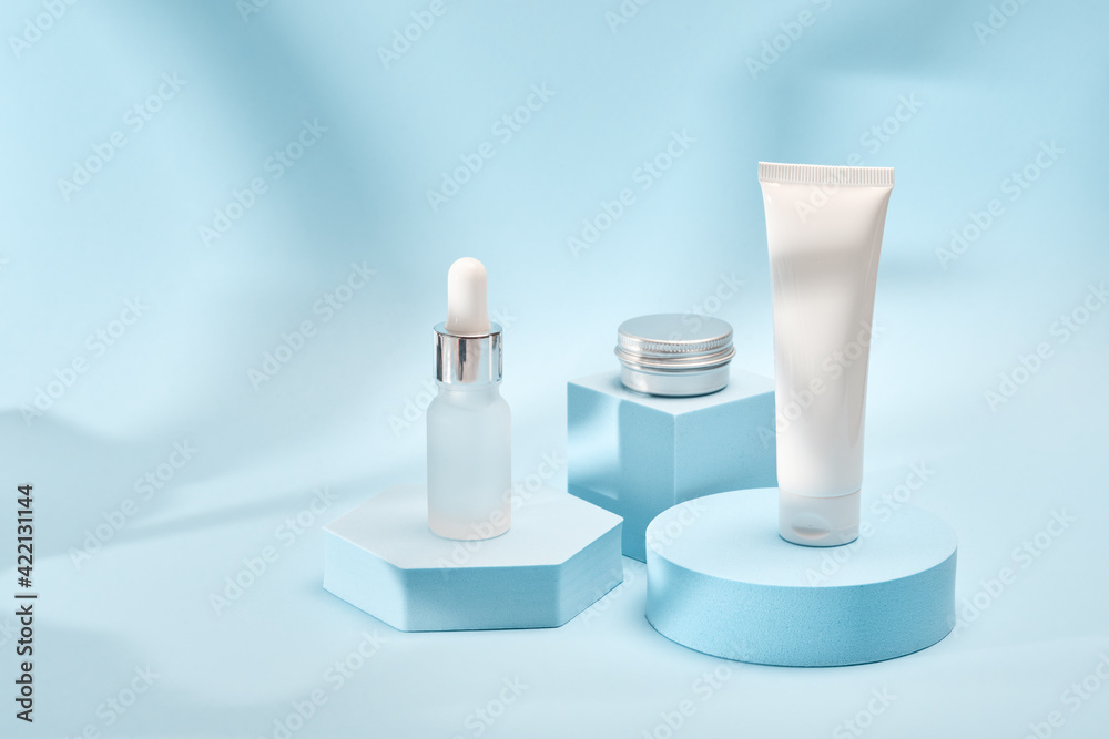 Three cosmetic product mockups on geometric podiums. Background for presentation of cosmetic Three cosmetic product mockups on geometric podiums. Background for presentation of cosmetic