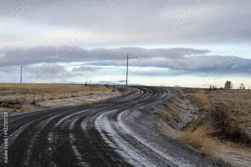 Snowy gravel road in the countryside