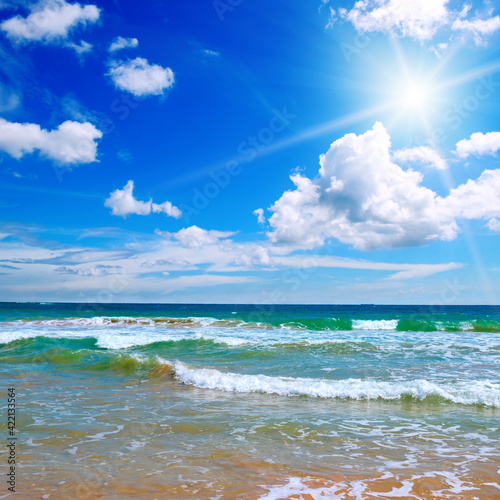 Fototapeta Naklejka Na Ścianę i Meble -  Beautiful seascape and sun on blue sky background.