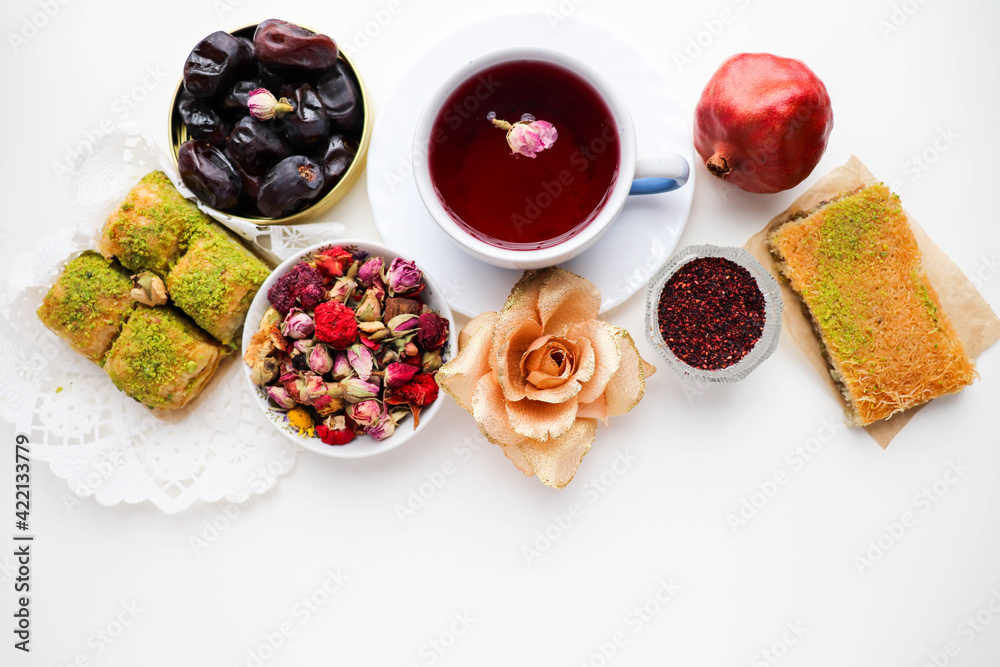 pomegranate tea in a teacup and oriental sweets pomegranate tea in a teacup and oriental sweets