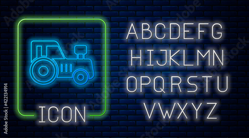 Glowing neon Tractor icon isolated on brick wall background. Neon light alphabet. Vector