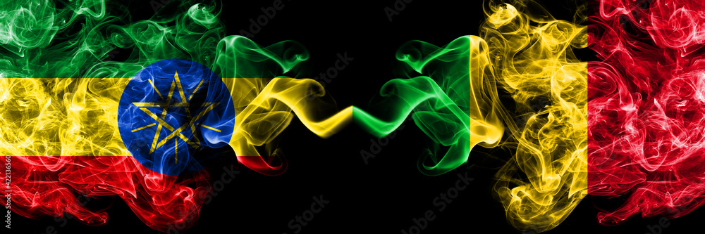 Obraz premium Ethiopia, Ethiopian vs Mali smoky mystic flags placed side by side. Thick colored silky abstract smoke flags.