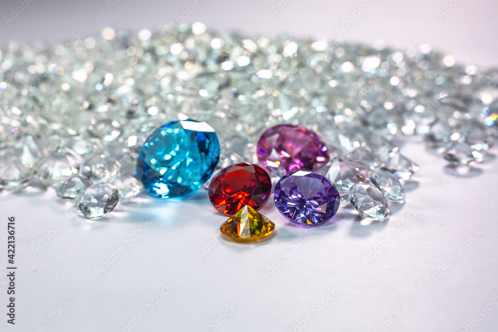 colorful diamonds are placed on a pile of white diamonds And keep turning. video 4k resolution shoot in studio. colorful diamonds are placed on a pile of white diamonds And keep turning. video 4k resolution shoot in studio.