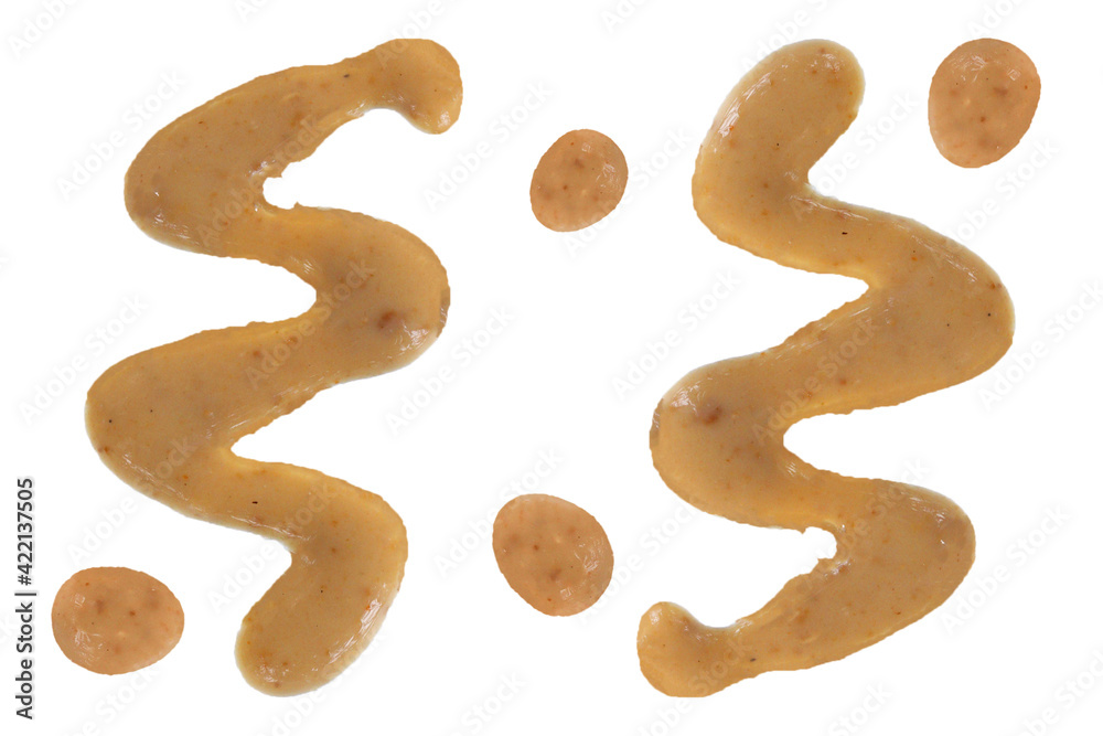 Sesame - peanut sauce isolated on white background. Top view, splash Sesame - peanut sauce isolated on white background. Top view, splash