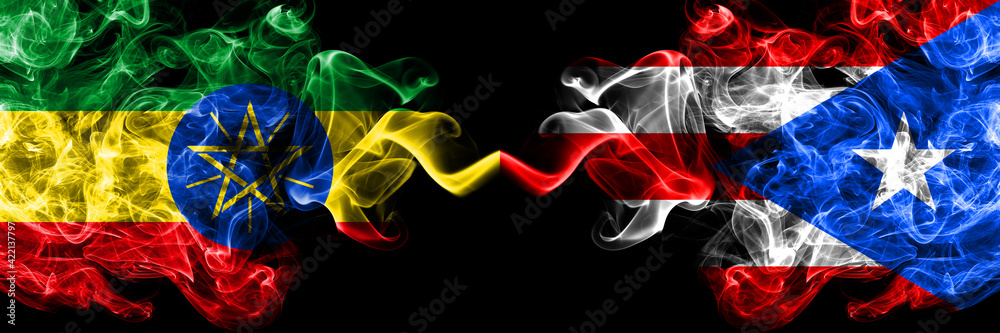 Ethiopia, Ethiopian vs Puerto Rico smoky mystic flags placed side by side. Thick colored silky abstract smoke flags. Ethiopia, Ethiopian vs Puerto Rico smoky mystic flags placed side by side. Thick colored silky abstract smoke flags.
