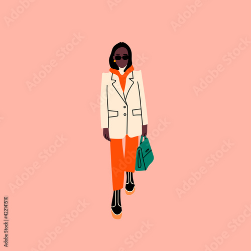 Cute black lady standing in trendy clothes and holding a purse or shopper. Front view. Modern fashion look. Hand drawn Vector trendy illustration. Flat design. Cartoon style. Poster or print template