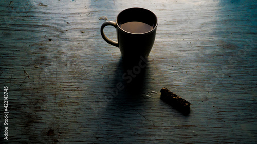 Fototapeta Naklejka Na Ścianę i Meble -  alone coffie cup and cake on wooden table