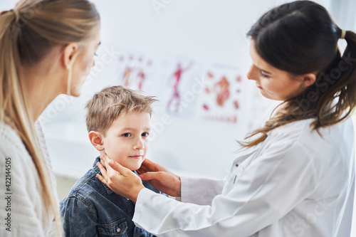 Obraz na płótnie Little boy having medical examination by pediatrician