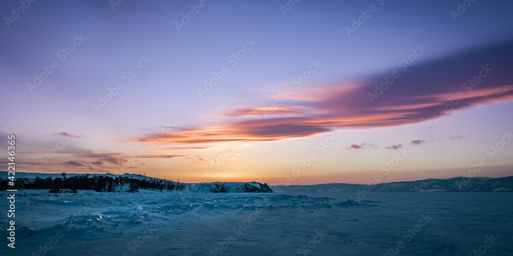 Sunset on the coast of winter Baikal
