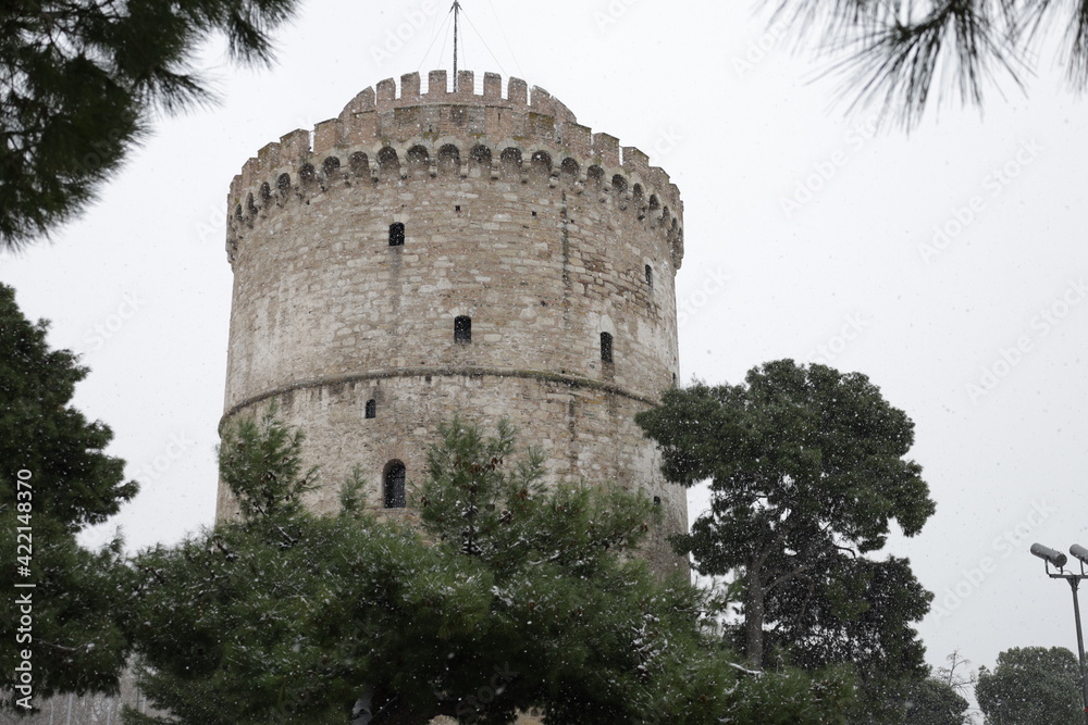 White tower monument on the port of Thessaloniki on a snowy day