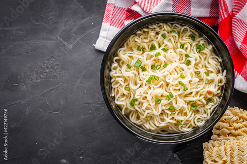 Canvas Print instant egg noodles on a dark stone background