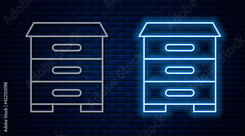 Glowing neon line Hive for bees icon isolated on brick wall background. Beehive symbol. Apiary and beekeeping. Sweet natural food. Vector