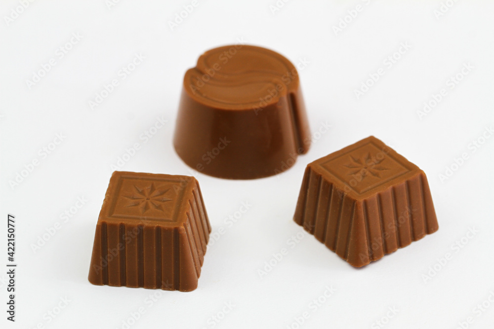 Three milky chocolates on white background