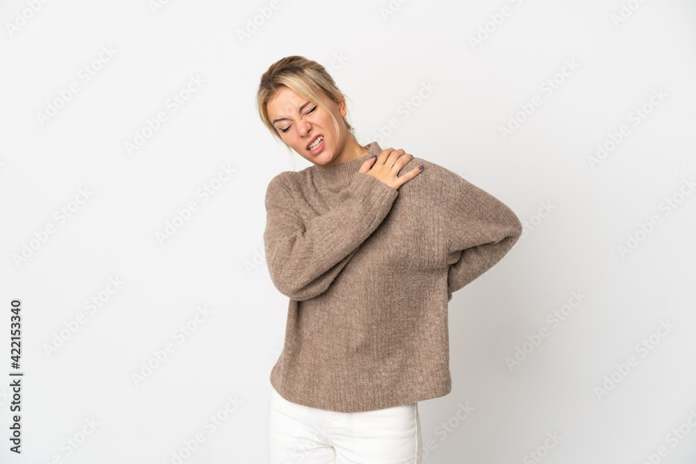 Young Russian woman isolated on white background suffering from pain in shoulder for having made an effort Young Russian woman isolated on white background suffering from pain in shoulder for having made an effort