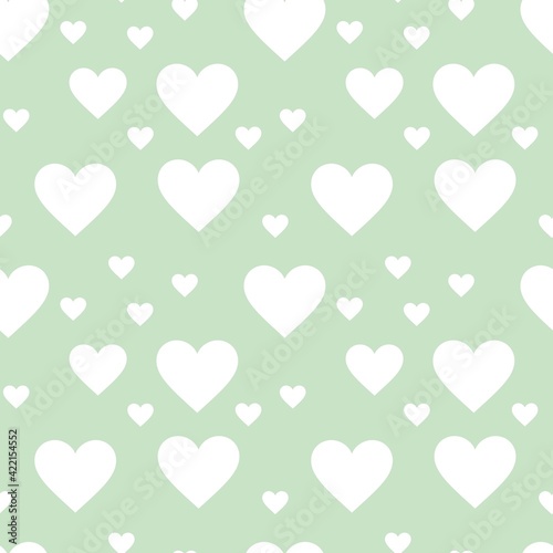 Colorful seamless pattern with hearth symbol and pastel green background