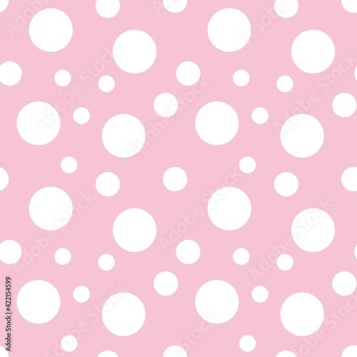 Colorful seamless dot pattern with pastel pink background 