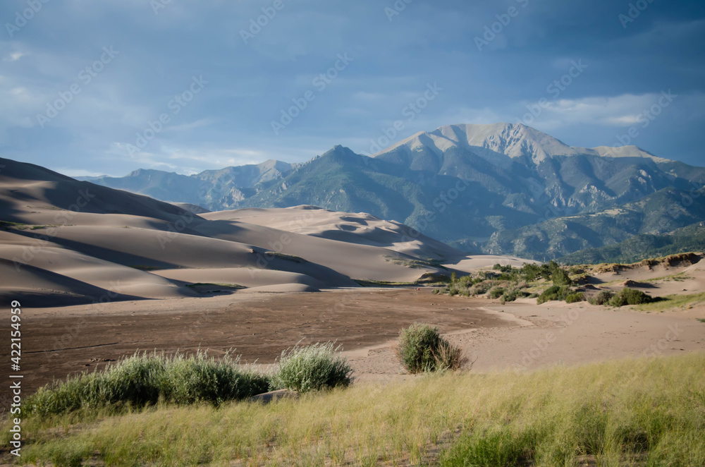 Great Sand Dunes National Park, Colorado, USA. Beautiful scenic majestic sand dunes and mountain peaks. Travel destination location for camping, hiking, relaxing and enjoying natures beauty. Great Sand Dunes National Park, Colorado, USA. Beautiful scenic majestic sand dunes and mountain peaks. Travel destination location for camping, hiking, relaxing and enjoying natures beauty.