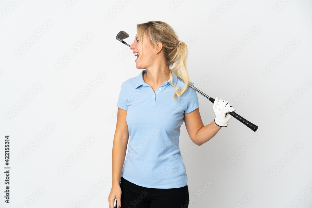 Young Russian golfer woman isolated on white background laughing in lateral position Young Russian golfer woman isolated on white background laughing in lateral position