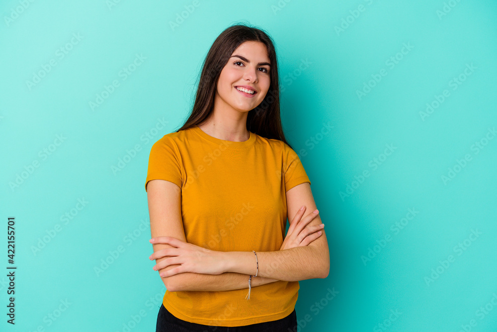 Young caucasian woman isolated on blue background laughing and having fun. Young caucasian woman isolated on blue background laughing and having fun.