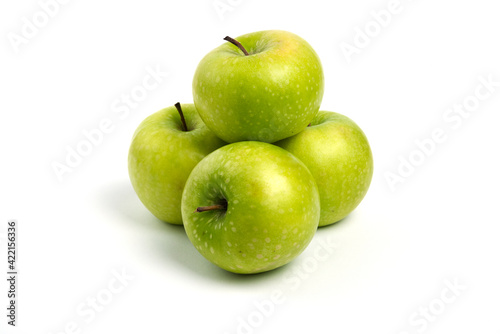 Three fresh whole and sliced apples on wooden piece