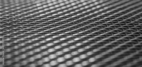 Black and white Macro Photography of stainless steel grid. Abstract background