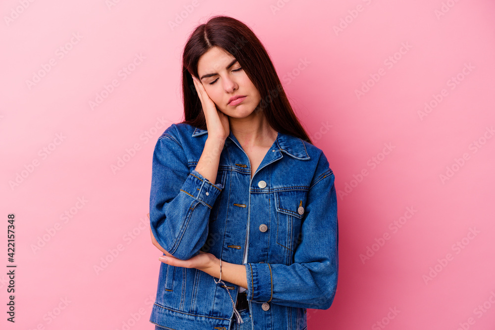 Young caucasian woman isolated on pink background who is bored, fatigued and need a relax day. Young caucasian woman isolated on pink background who is bored, fatigued and need a relax day.