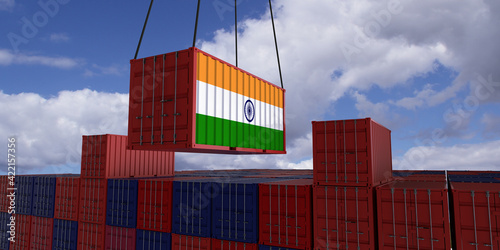 A freight container with the indian flag hangs in front of many blue and red stacked freight containers - concept trade - import and export - 3d illustration