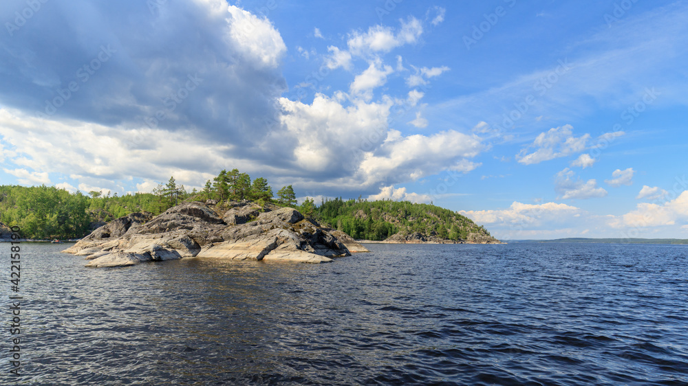 One of the islands of lake Ladoga. The photo was taken during a boat ride on an summer day.