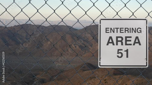 Entering Area 51 Sign On A Fence At The Military Base In The Nevada Desert At Sunset photo