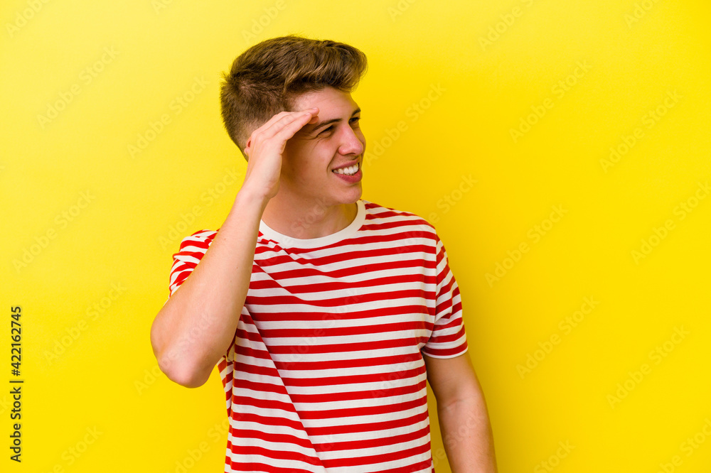 Young caucasian man isolated on yellow background joyful laughing a lot. Happiness concept. Young caucasian man isolated on yellow background joyful laughing a lot. Happiness concept.