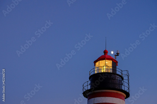 Evening Light and moonrise at the Lubec Lighthouse on the Northern coast of Maine