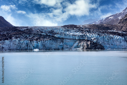 Alaska Glacier entering water with global warming and climate change melting the glaciers concept