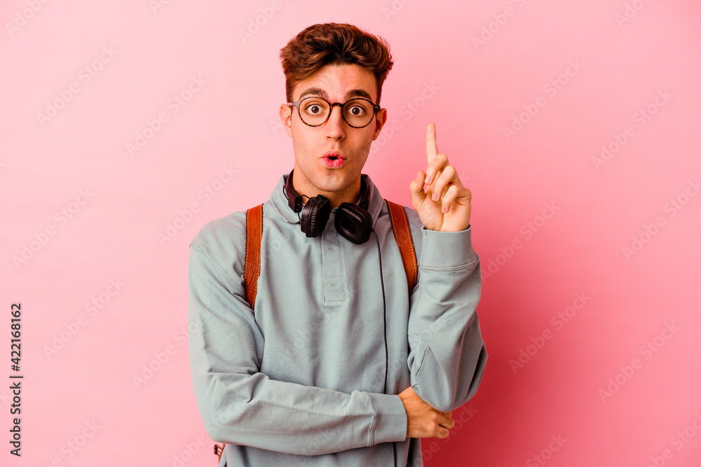 Young student man isolated on pink background having some great idea, concept of creativity. Young student man isolated on pink background having some great idea, concept of creativity.