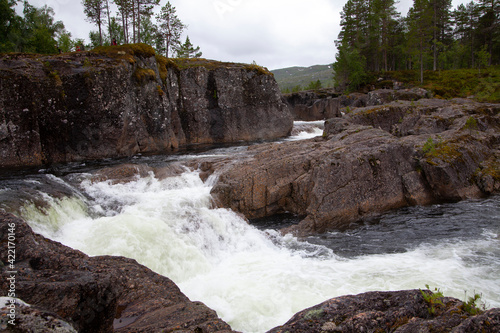 River that flows through a mountain area called Trollheimen (Home of Trolls) in Norway photo