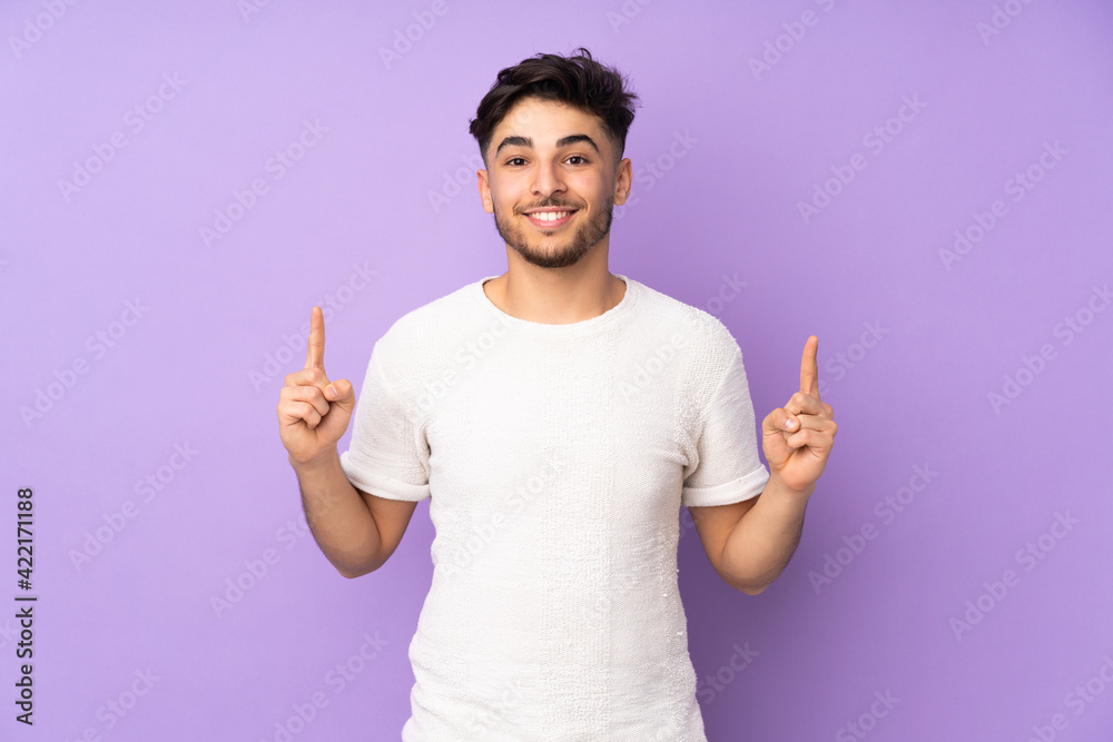Arabian handsome man over isolated background pointing up a great idea Arabian handsome man over isolated background pointing up a great idea