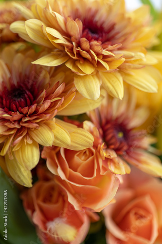 yellow, orange and red bouquet of roses, chrysanthemums and tulips