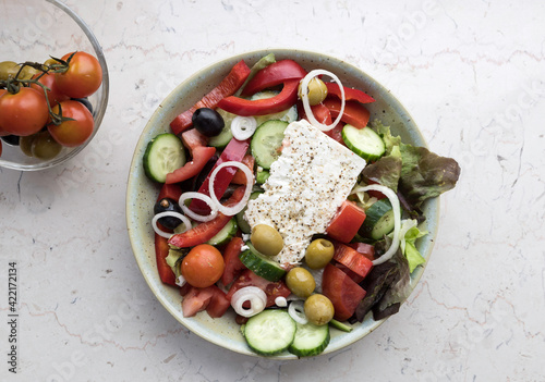 Cooked greek salad with paprika,tomatoes,cucmber and cheese feta .
Flat lay