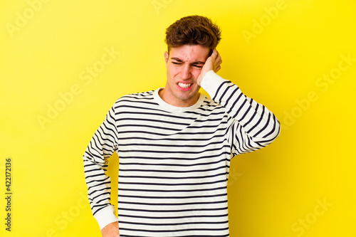 Young caucasian man isolated on yellow background celebrating a victory  passion and enthusiasm  happy expression.