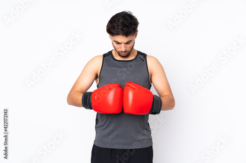 Sport Arabian man isolated on white background with boxing gloves