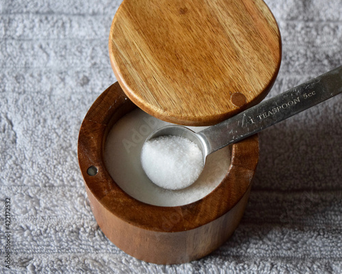 Top view of a teaspoon of salt