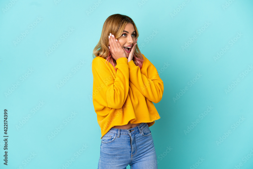 Young woman over isolated blue background with surprise facial expression Young woman over isolated blue background with surprise facial expression