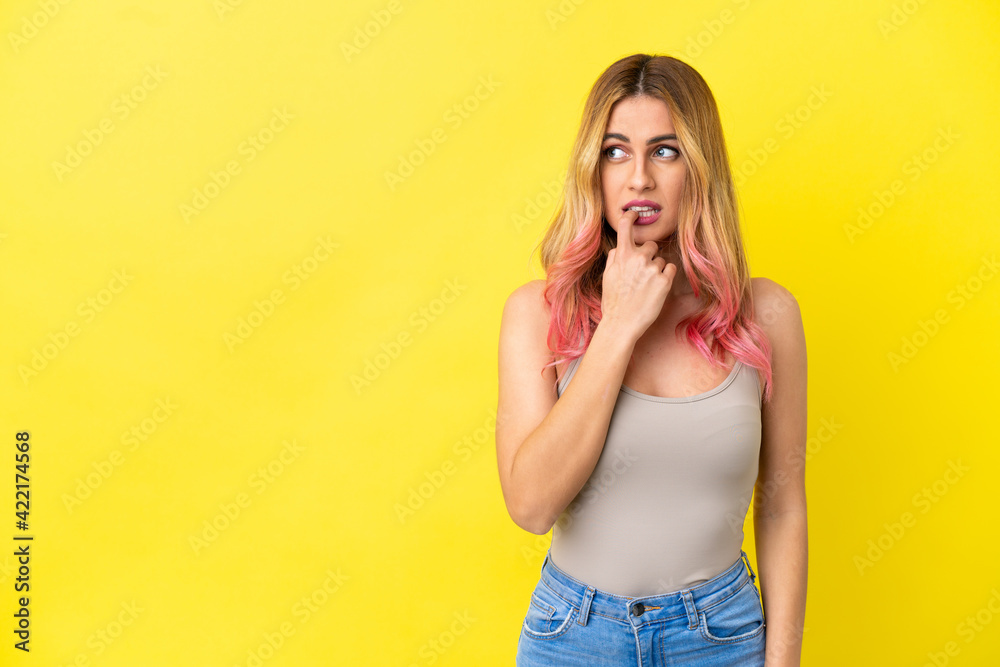 Young woman over isolated yellow background nervous and scared Young woman over isolated yellow background nervous and scared