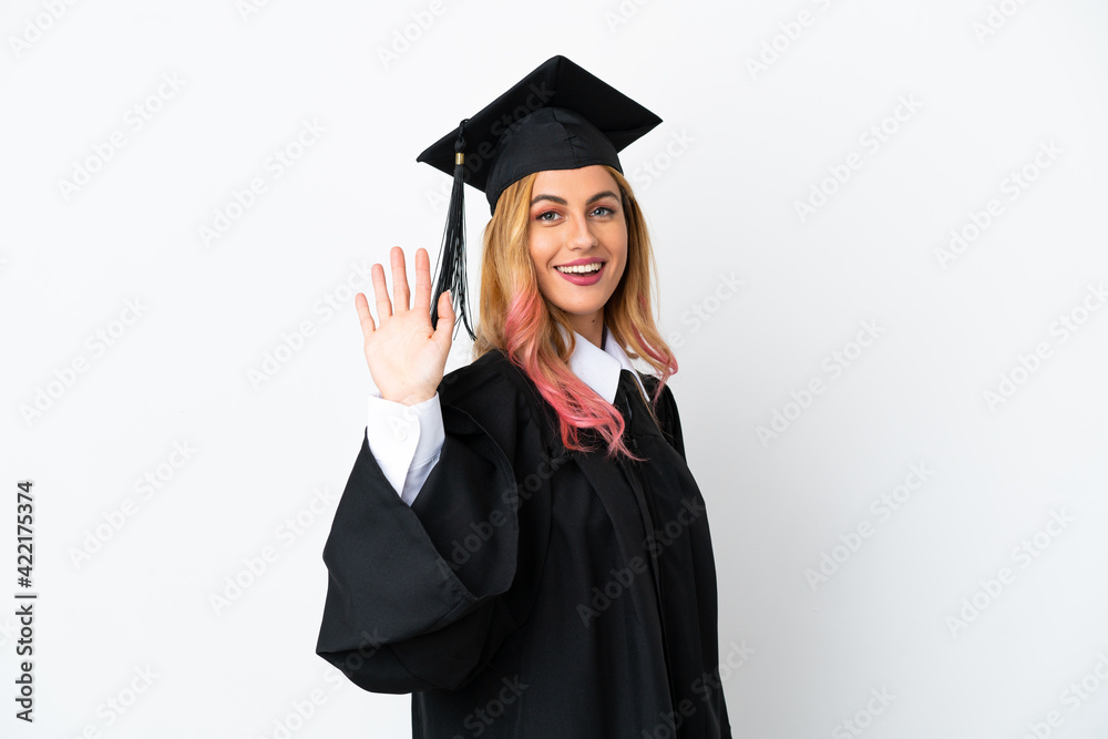 Young university graduate over isolated white background saluting with hand with happy expression Young university graduate over isolated white background saluting with hand with happy expression