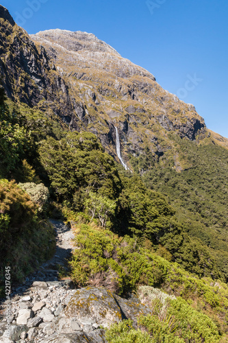 hiking track leading to Earland Falls waterfall on Routeburn Track in Fiordland National Park, South Island, New Zealand photo