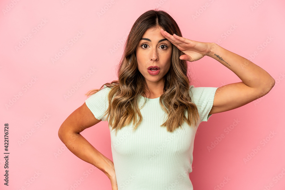 Young caucasian woman isolated shouts loud, keeps eyes opened and hands tense. Young caucasian woman isolated shouts loud, keeps eyes opened and hands tense.