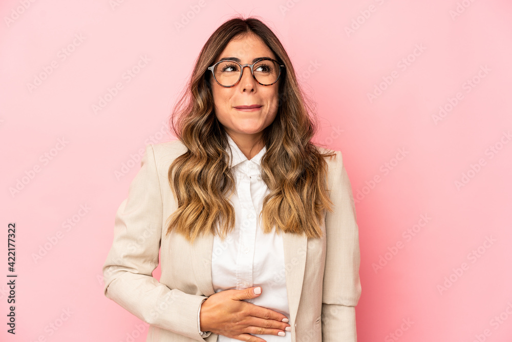 Young caucasian woman isolated touches tummy, smiles gently, eating and satisfaction concept. Young caucasian woman isolated touches tummy, smiles gently, eating and satisfaction concept.