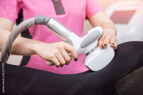 Closeup LPG machine massage for lifting body. Woman getting beauty therapy against cellulite in spa salon